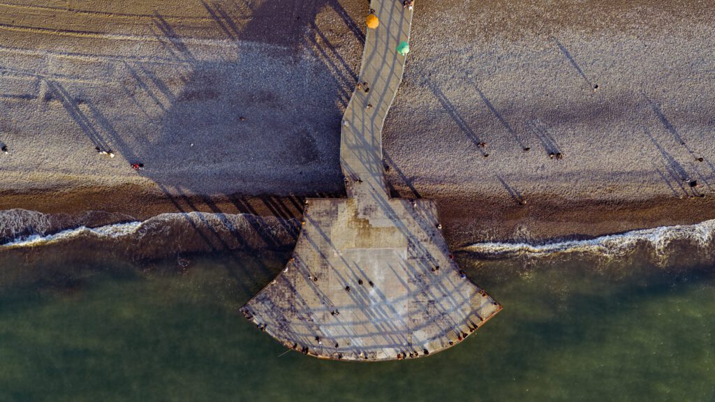 Aerial pier shadows sunset