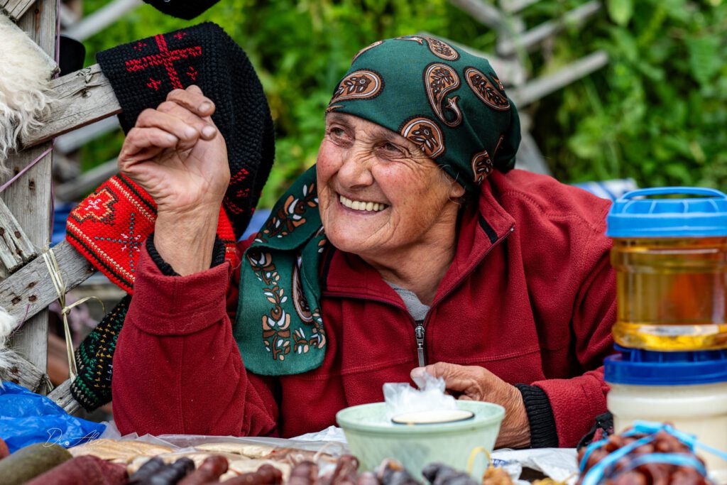 Elder woman laughing market